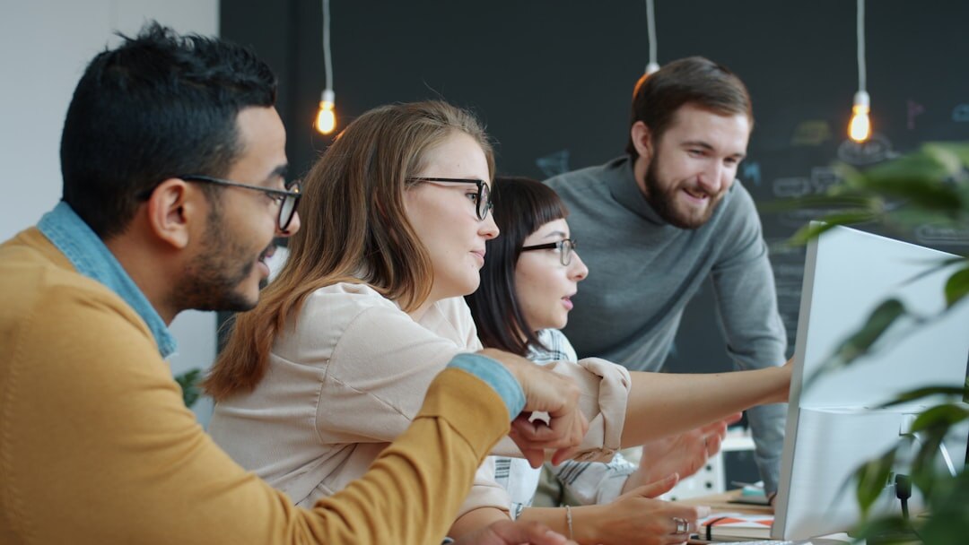 Diverse media team working together in modern office